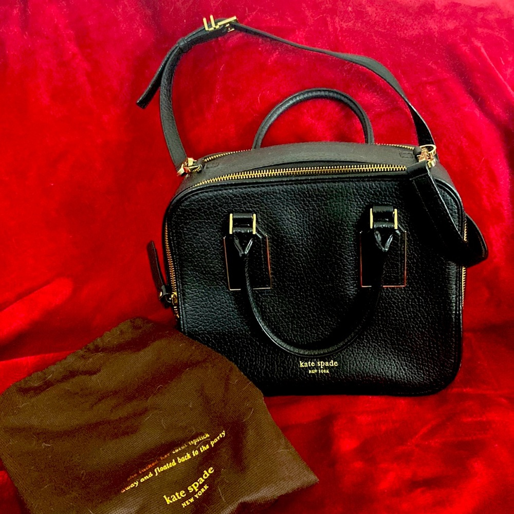Camera bag style, pebble leather, strap, dust bag included.
